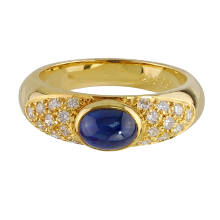 12399 Sapphire & Diamond Band Designed and Handmade by Kaufmann de Suisse in 18kt Yellow Gold featuring one Oval Cabochon cut Sapphire weighing 1.38cts