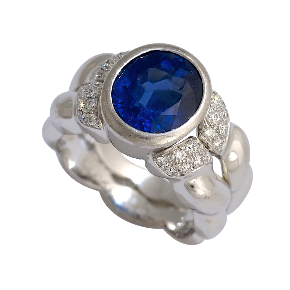 19376 Double Flowing Lines Blue Sapphire Ring Designed & Handmade by Kaufmann de Suisse in 18kt White Gold featuring one Bezel Set Oval