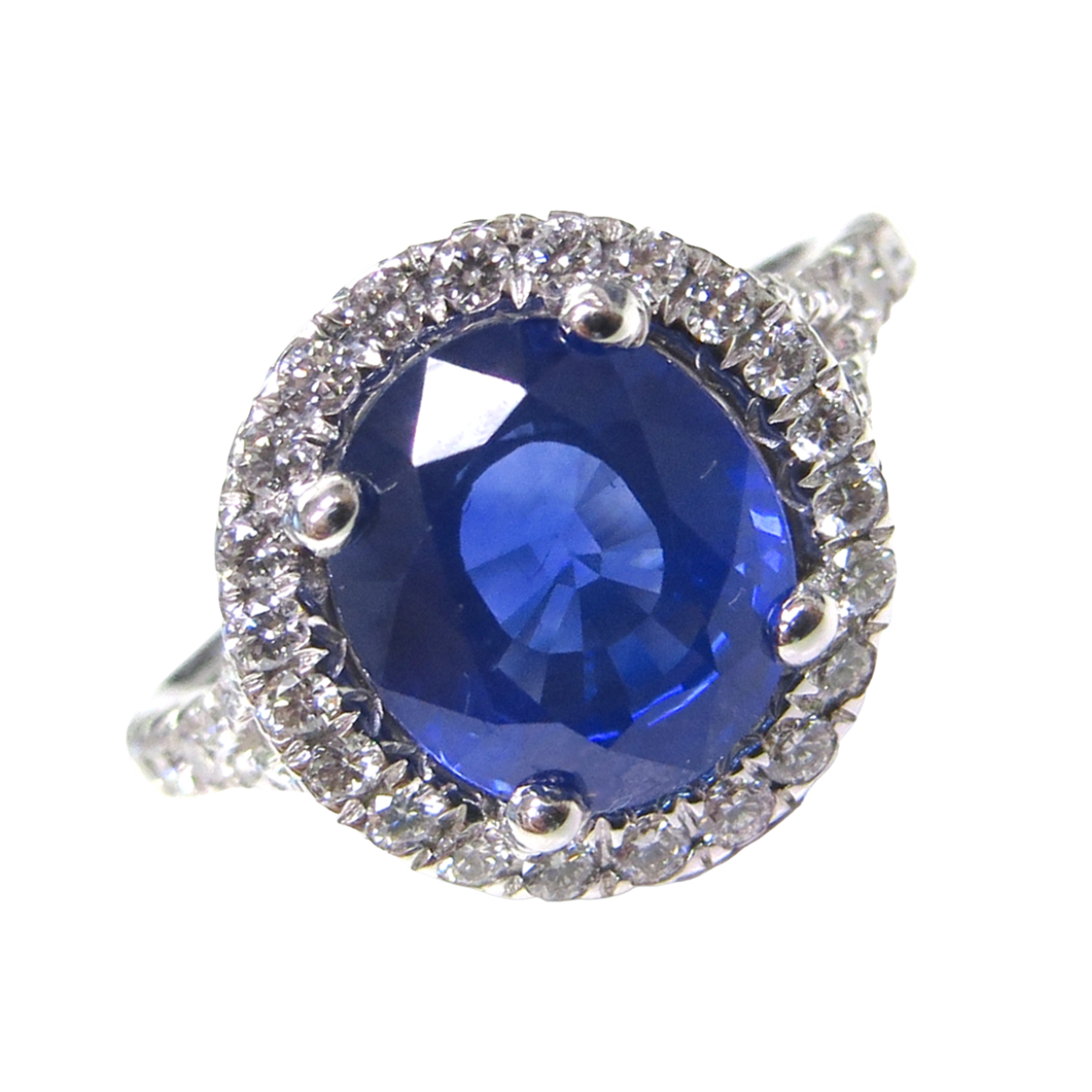 23916 Sapphire and Diamond Halo Ring Designed and Handmade in 18kt White Gold featuring one Oval 3.15cts Blue Sapphire surrounded by 46 Round Brilliant cut GVS Quality Diamonds