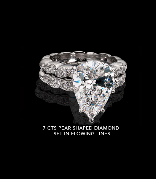 7-CTS-PEAR-SHAPE-DIAMOND-SET-IN-FLOWING-LINES.jpg