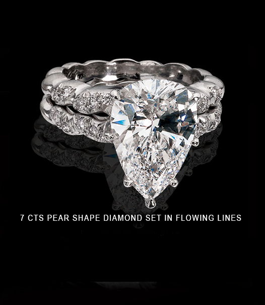 7-CTS-PEAR-SHAPE-DIAMOND-SET-IN-FLOWING-LINES.png